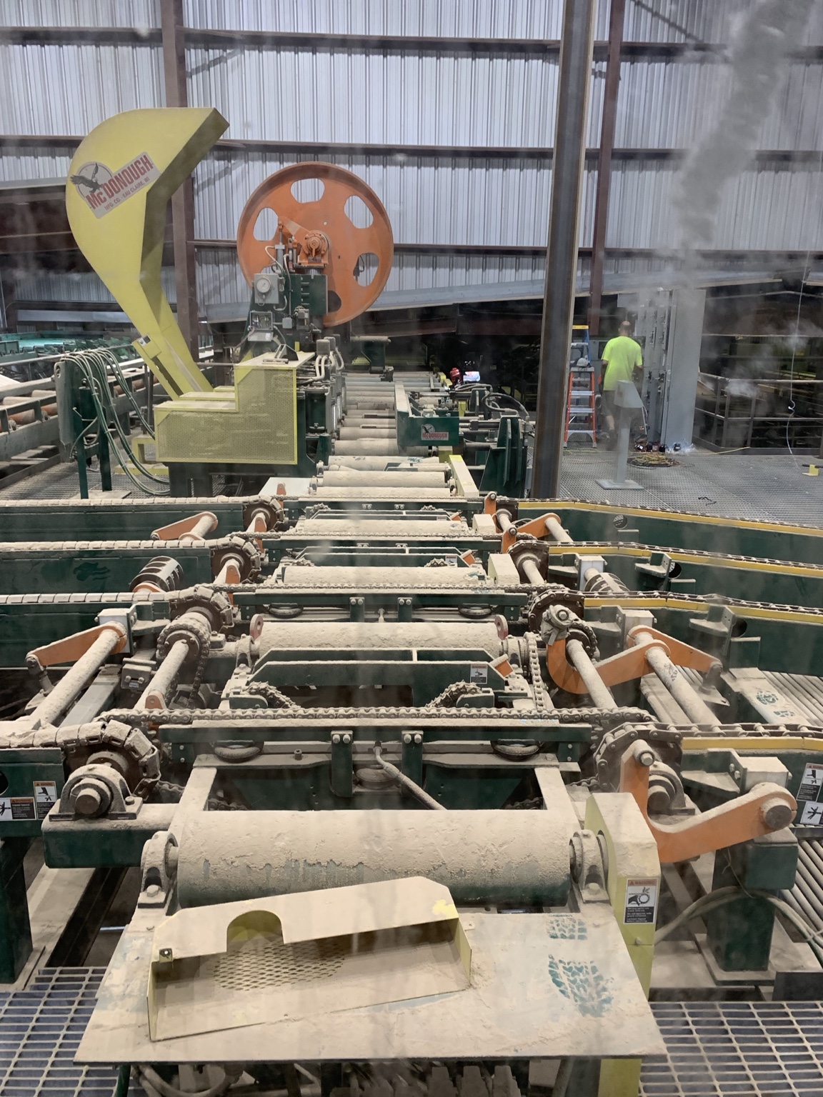 Production machinery and material handling equipment inside a mill