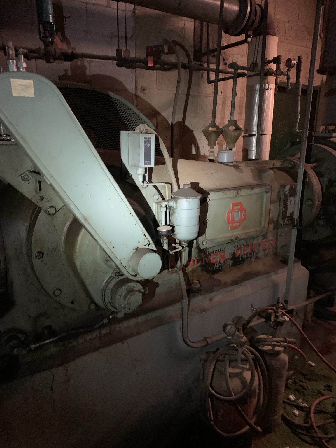 Motor and belt drive on industrial machinery