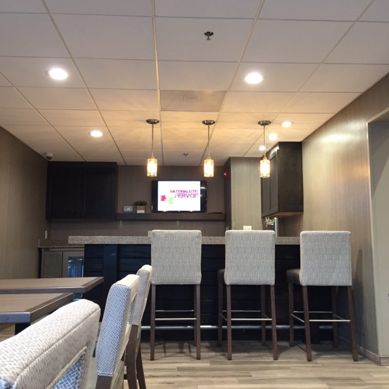 Recessed and pendant lighting in a furnished interior